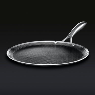 Low-angle view of hybrid stainless steel griddle pan with long handle
