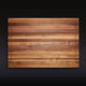 Top view of large striped walnut cutting board with juice groove