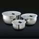 Three stainless mixing bowls with clear vacuum seal lids on black background